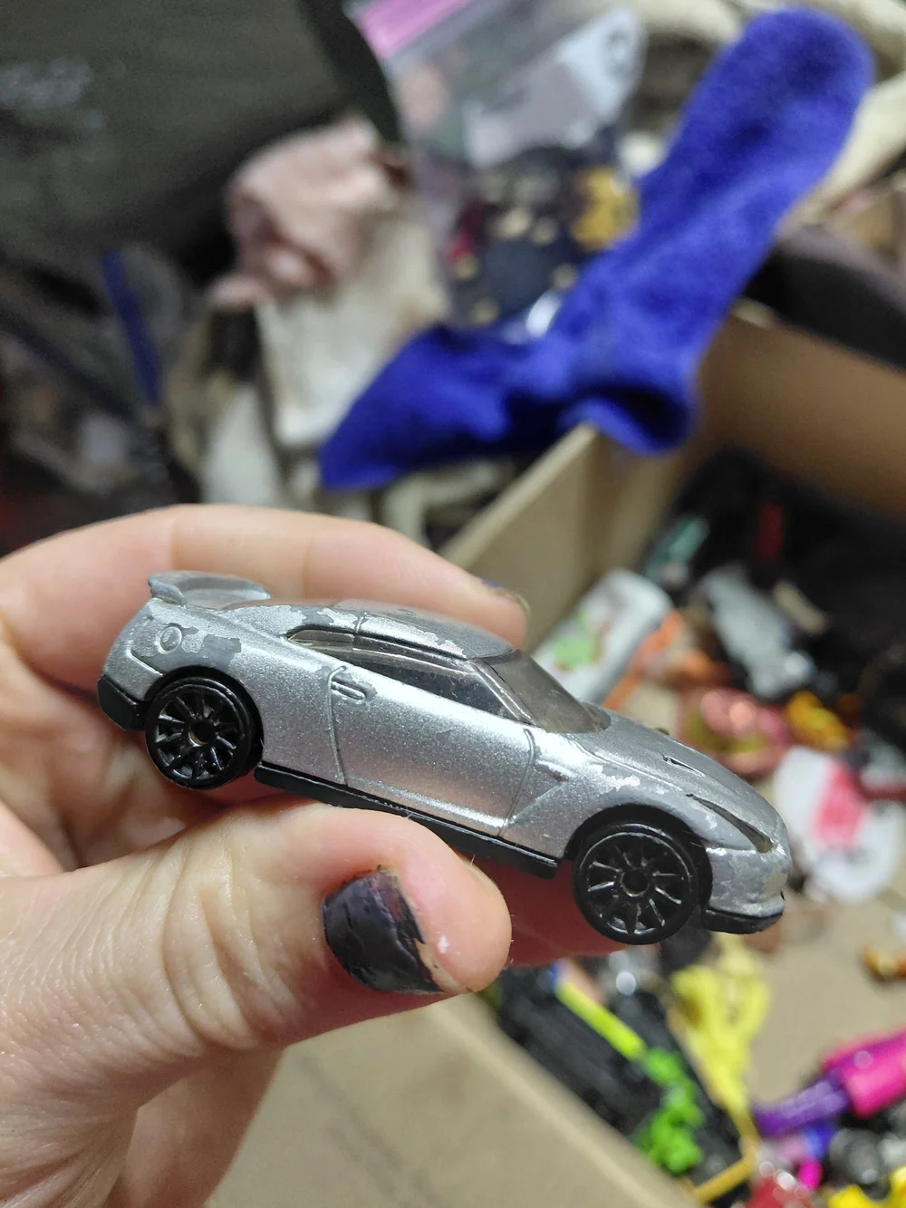 1:64 scale Hot Wheels 2009 Nissan GT-R (R35) die-cast car.